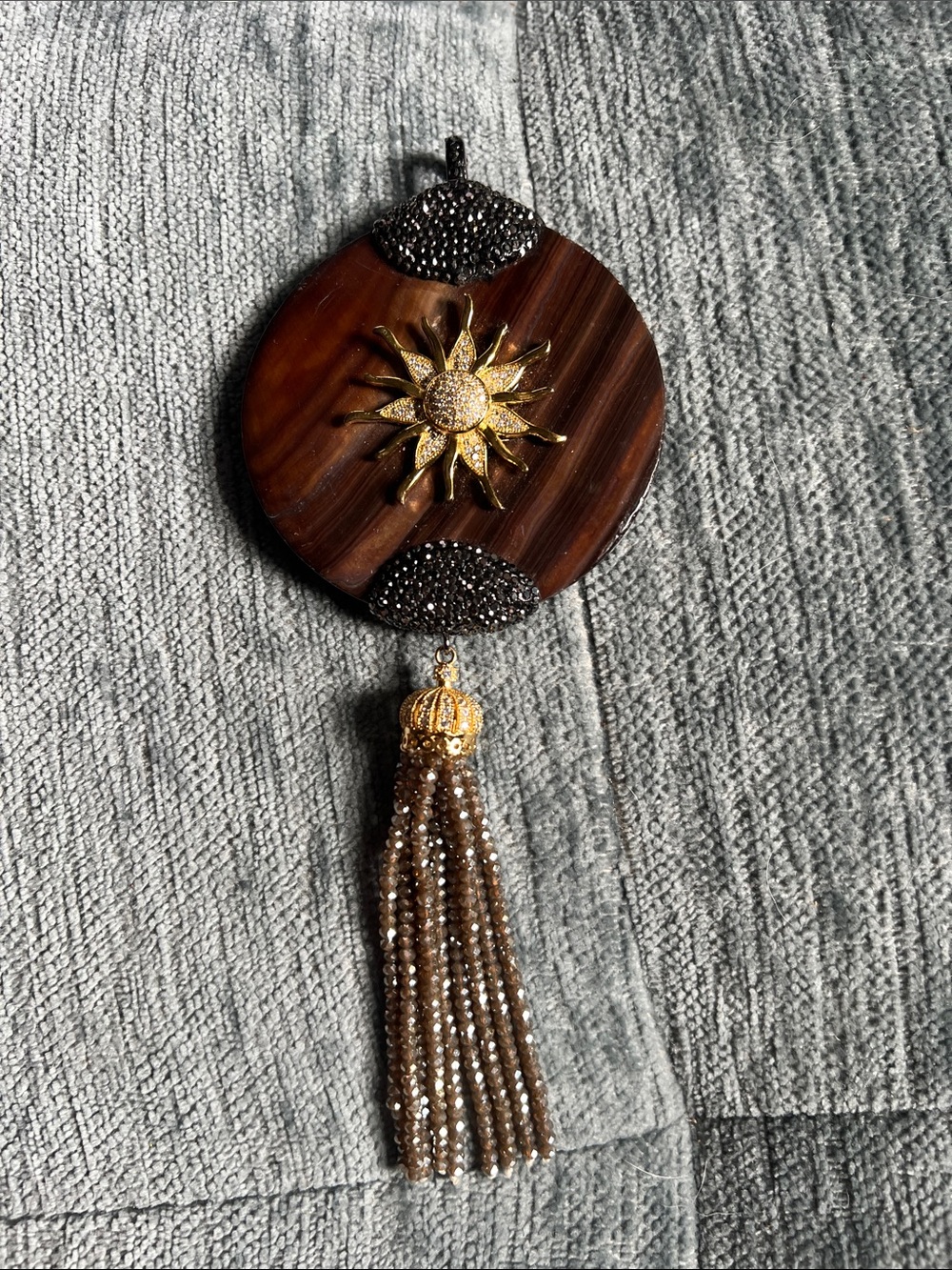 Gold Sunburst Brown Pendant with Beaded Tassel